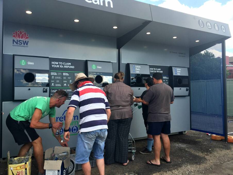 GETTING THEIR MONEY'S WORTH: Users line up to deposit containers at the Goulburn Return and Earn reverse vending machine. Picture: Baz Ruddick