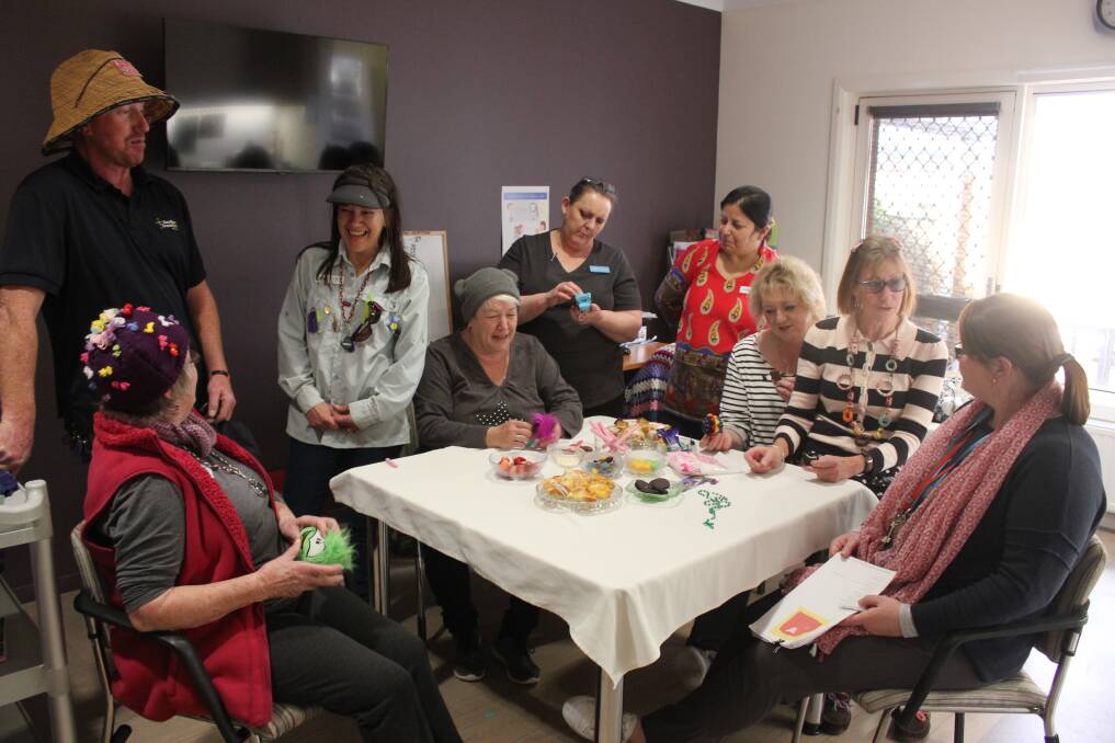 WINDING DOWN: Staff members of Southern Cross Care wearing colourful clothes, having some snacks and stressing less. Photo: Mariam Koslay. 