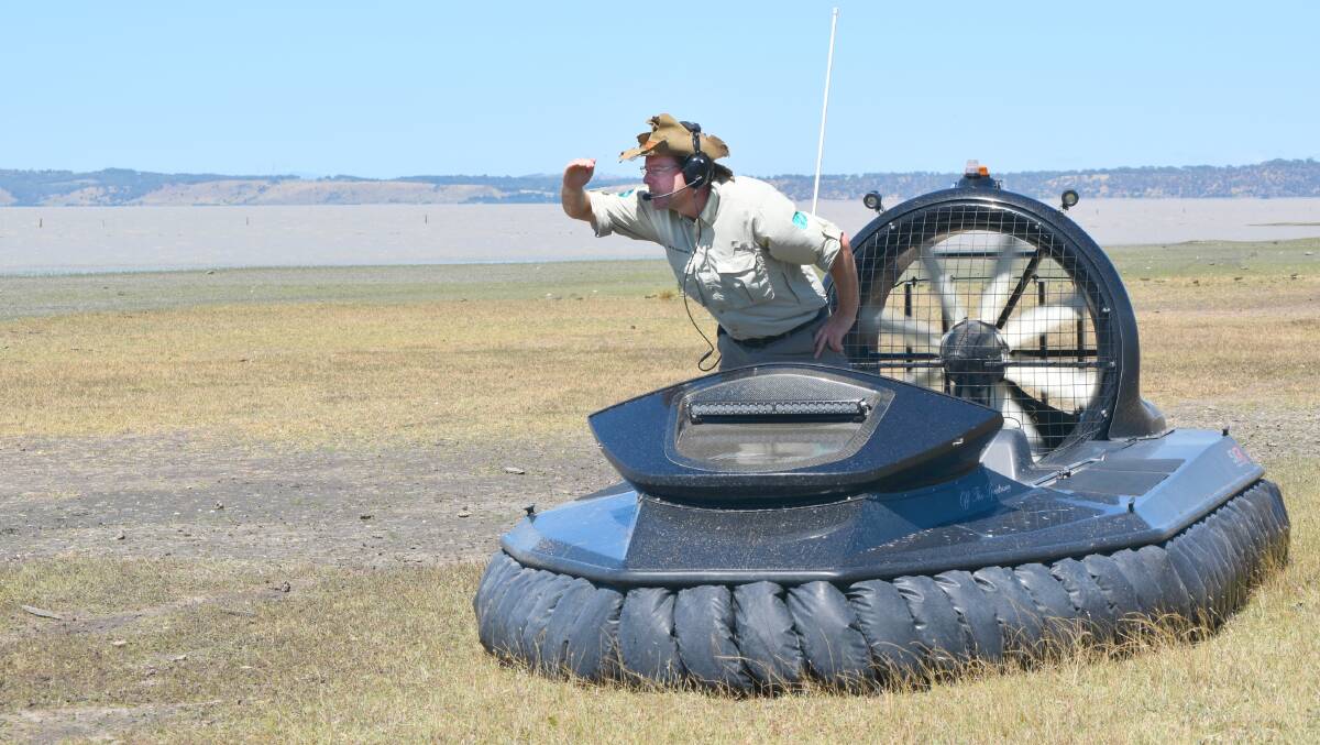 Tim the Yowie man on a hovercraft looking over Lake George. Photo: supplied. 