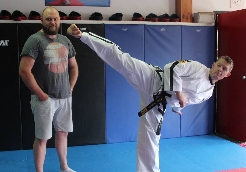 A STRIKING SUCCESS: Creator of 'Goulburn Working Man Auction' Gordon Schüberg with martial arts teacher Craig Harmer, who has offered a women's self-defence class for the auction.
