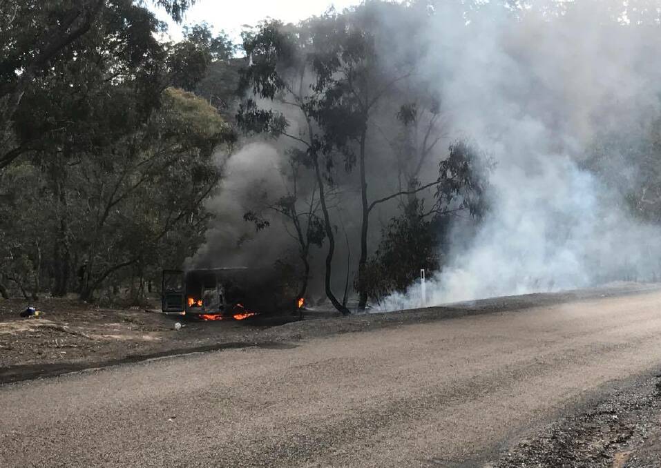 A burning car on the side of Abercrombie Road on July 7. Residents believe the Golspie tower should cover areas along the Goulburn to Oberon road to increase safety in the region. Photo: supplied. 