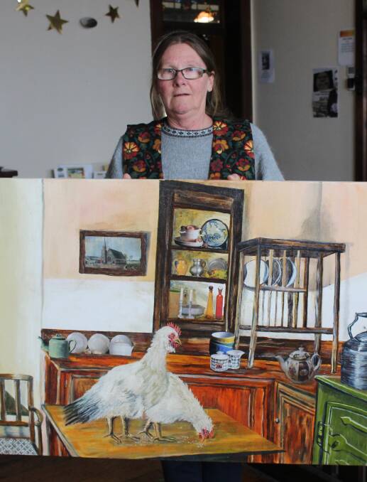 LOCAL PERSPECTIVE: Artist Di Smith with her painting 'Just Another Morning' in the lead-up to her exhibition. Photo: Mariam Koslay