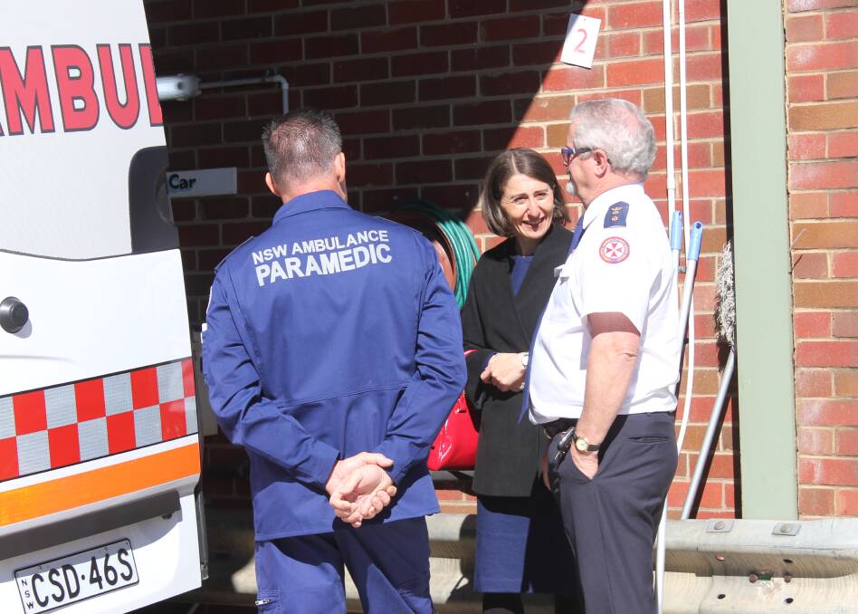 UPGRADE: NSW Premier Gladys Berejiklian with NSW Ambulance deputy director of the southern sector Brian White after Saturday's announcement. Photo: Mariam Koslay