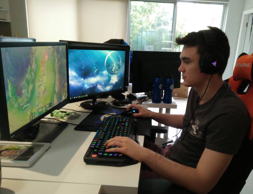 PRACTICE: Sin Gaming, League of Legends, team member, Jake Sharwood-Glennie known in the Oceania Professional League (OPL) as Rogue, getting in some practice at the teams  share-house. Photo: supplied