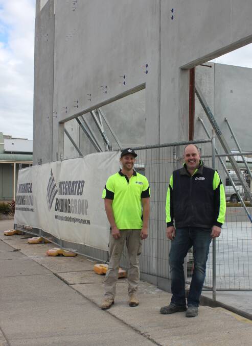 DEVELOPMENT BOOM: Mathew Langbein and Tony Boyd of Integrated Building Group outside the retail site on the corner of Auburn and Bradley Street. Photo: Mariam Koslay.