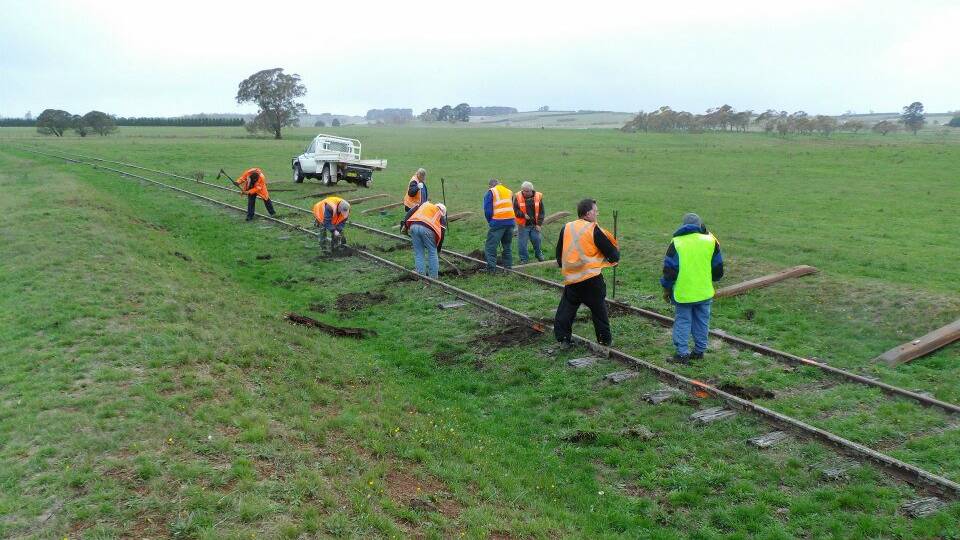 TRACK WORK: Goulburn Crookwell Heritage Railway volunteers working on the rail line to McAlister station in 2013. Photo: supplied