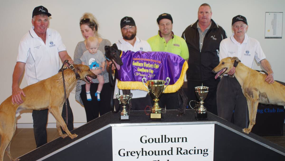 PODIUM: Winner Champion Model (centre), with second-placed Jock Colley (right) and third Slamming Thunder. Workers Club president Tony Dawson (second right) presented the trophies. Photo: Darryl Fernance