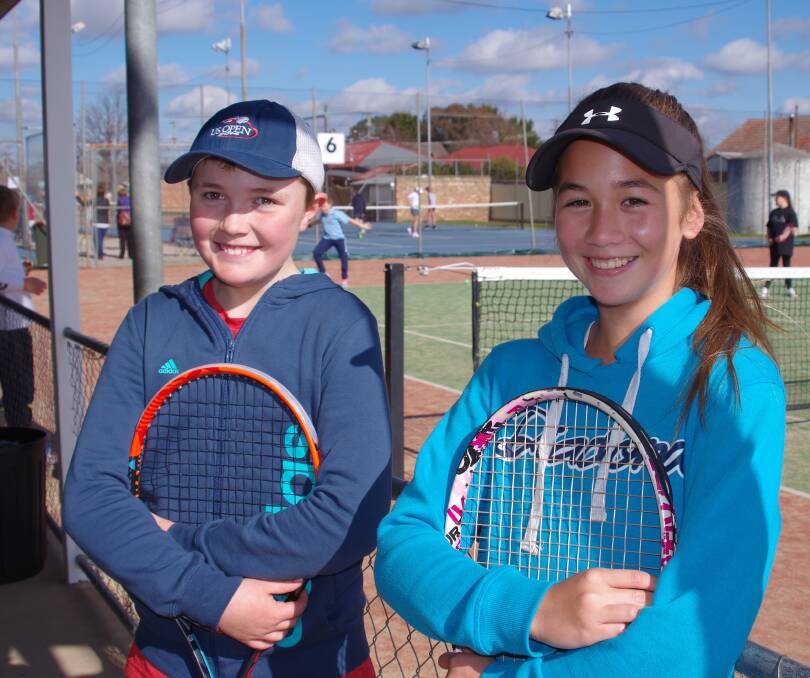 PARTNERS: Goulburn under 13s mixed doubles partners Braeden Ferris and Chantelle Barling between matches on Sunday at Goulburn Tennis Club’s Bishop Street courts.Photo: Darryl Fernance