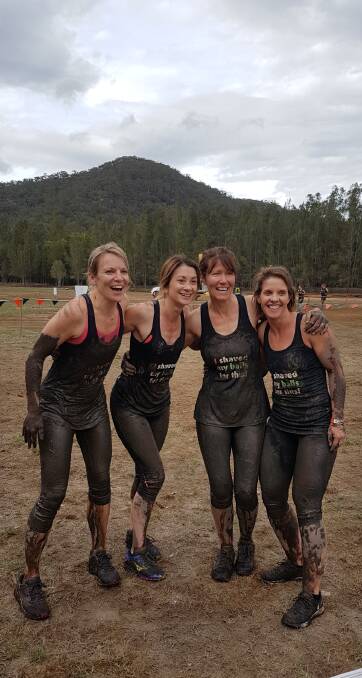 MUDDY MATES: Nadine Moroney Rebecca Norris, Donna Boyt and Brooke Stephens could still laugh after the tough physically and mentally testing Tough Mudder obstacle course fun run on Saturday. Photo: supplied