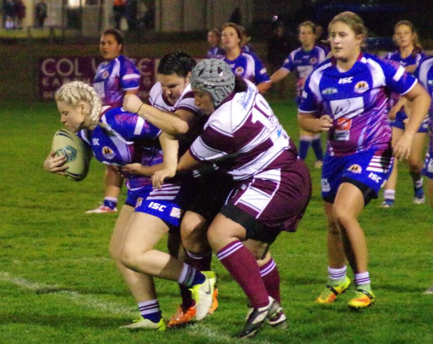 PULLING FORWARD: Goulburn's Ebony Bachta pulls hard to gain ground before she is brought down by the Queanbeyan Roos on Friday night. Photo: Darryl Fernance