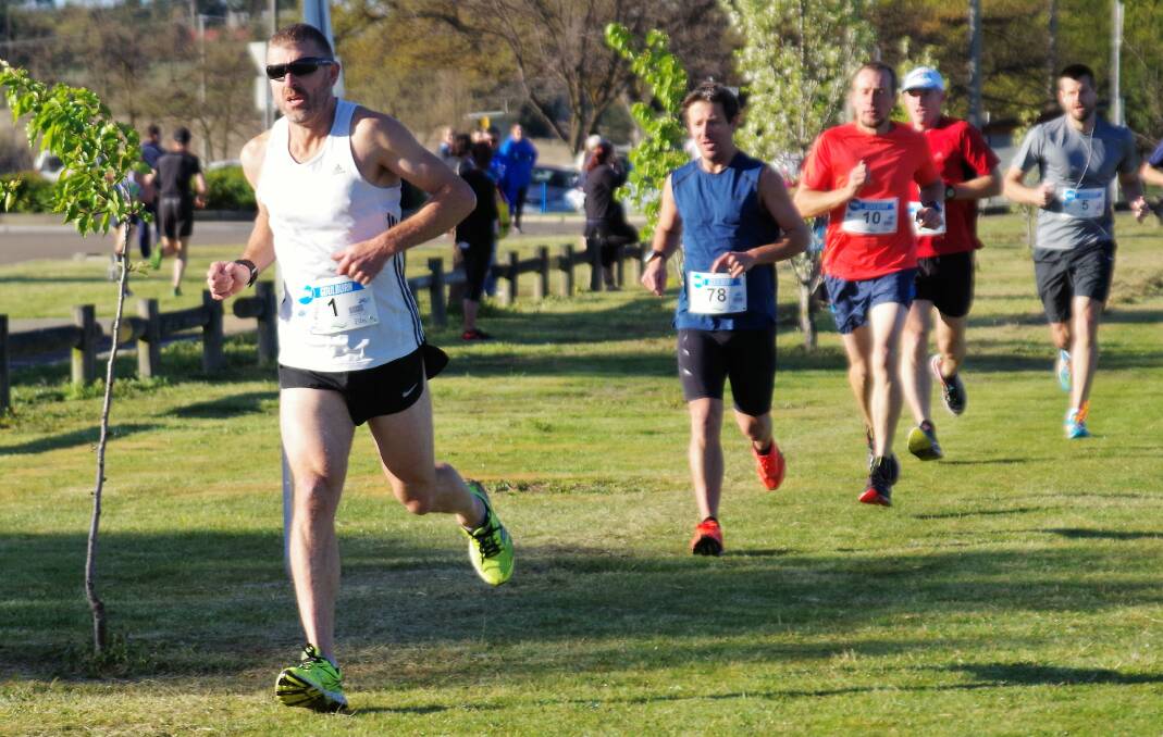 Runners,  in the 5 and 10km runs on the way out of Carr Confoy Park, with Andrew Oberg leading the group, in the early stage of the events.