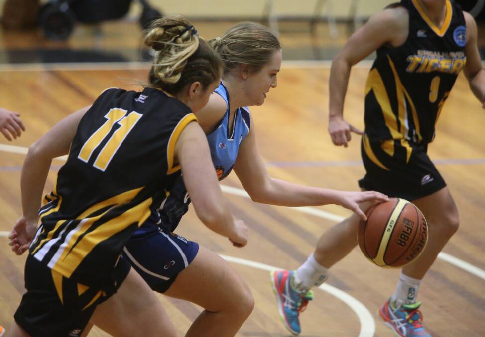 CONTROLLING: Goulburn's Carissa Moroney controls the play but is closely followed by Tigers' Chiara Arthur in the exciting clash at Bomaderry on Saturday. Photo: Robert Crawford, South Coast Register
