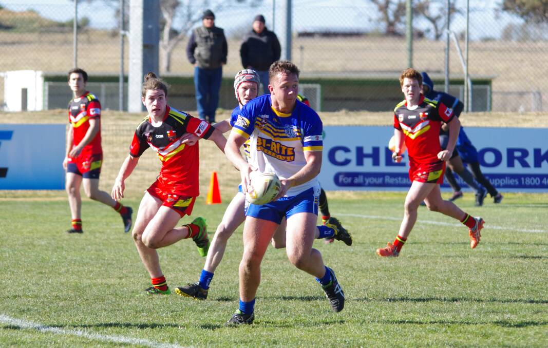 LOOKING FOR SUPPORT: Goulburn's Mitchell Atkinson looks for support as he charges down the field during the game against Gungahlin Bulls. Photo: Darryl Fernance.