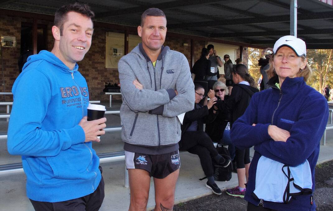 Brad White,Steve Boyt and Beth Hoskins chat while waiting for the pre-race briefing at Carr Confoy Park on Sunday morning.