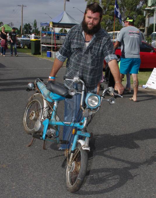HAPPY PURCHASER: Al Heaney from Wollongong found this small bike that needed some TLC amongst the stalls at the Goulburn Showground. Photos: Darryl Fernance
