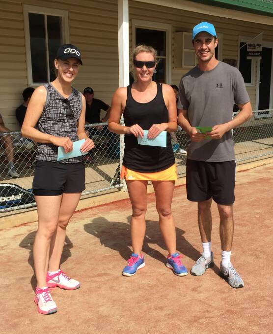 DOUBLES: Claire Smith and Natalie Rowsell won A grade ladies doubles championship last weekend. Club coach David Ridland presented the prize. Photo: supplied