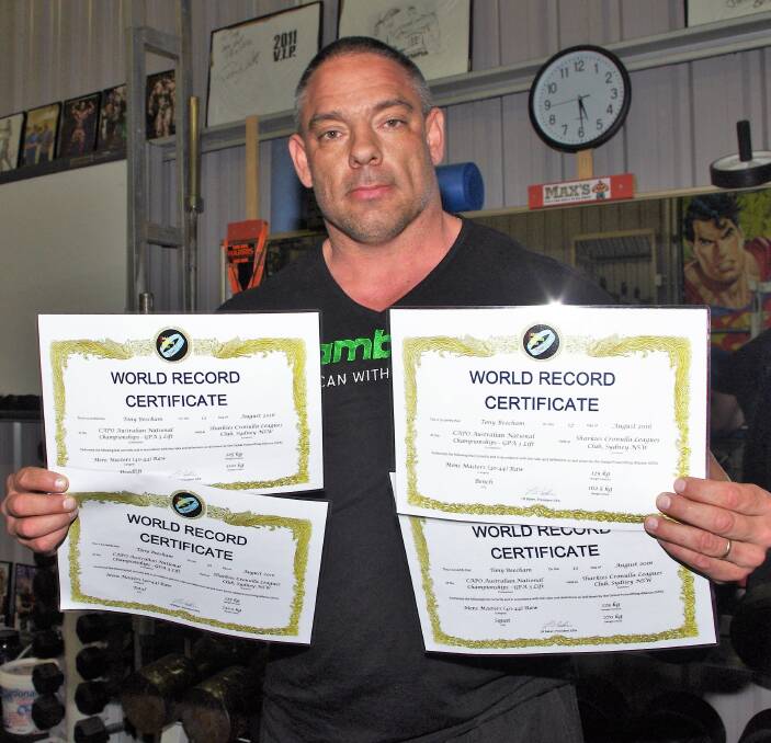 WORLD RECORDS: Powerlifter Tony Beecham with his four world record certificates from the Global Powerlifting Alliance achieved at the CAPO National Championships in August. Photo: Darryl Fernance