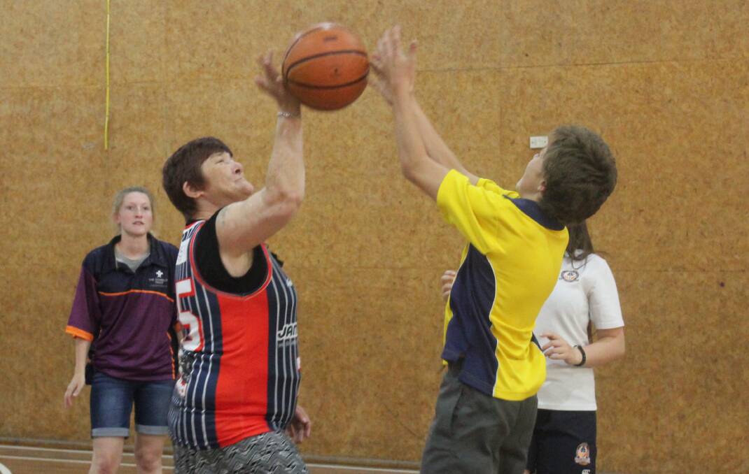  Melissa Kerby  puts a shot up which is blocked by one of the Goulburn High School students during a basketball game. Photo: Maeve Carragher
