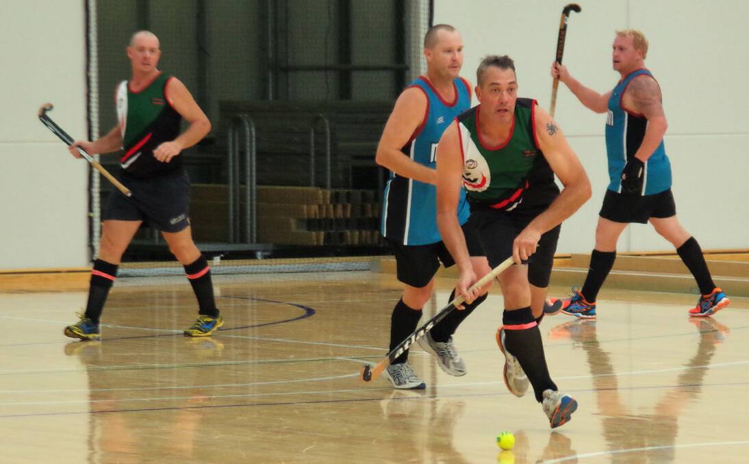 RUNNING THE BALL: Mark Robetson in action for Goulburn at the Veolia Arena against a team from Nepean during  the Masters Indoor Championships weekend, held earlier this year. Photo Darryl Fernance
