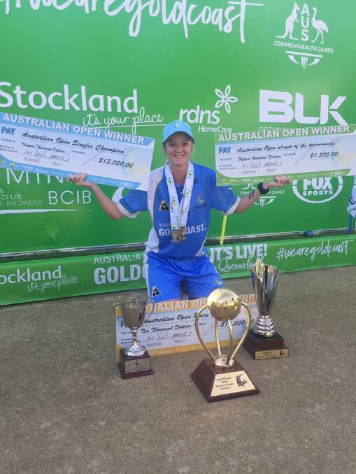 PAY DAY: Ellen Ryan with the Australian Bowls Singles and Pairs Championship trophies and the winners cheques plus her Player of the Tournament bonus. Photo: supplied