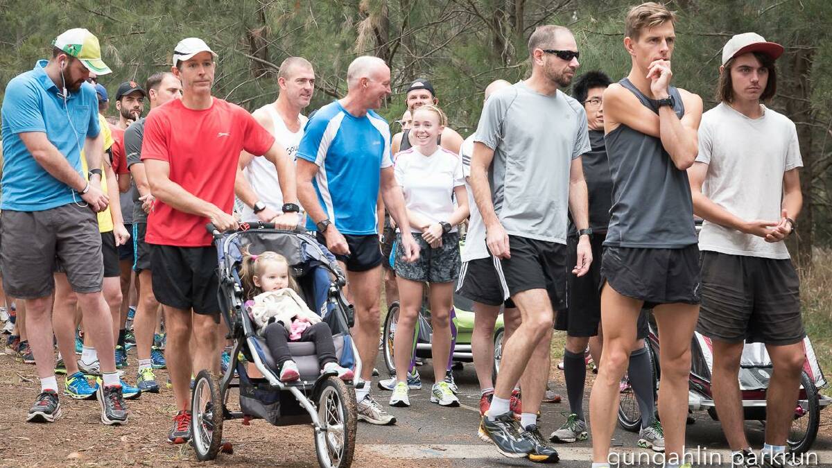 PARTICIPANTS: Goulburn parkrun enthusiasts Jacqui and Andrew Oberg, Rod Smith, Daniel Hopkins with Canberra based Paralympian Michael Roeger  and others awaiting the starters gun at a Gungahlin parkrun. Photo: supplied
