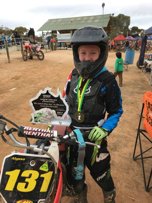 AUSTRALIAN CHAMPION: Alyssa Wallace with her Australian Junior Long Track Motorcycle Championship trophy at  the Northwest Victorian Motorcycle Club's Mildura track, on Sunday July 15. Photo: Lindsay Wallace