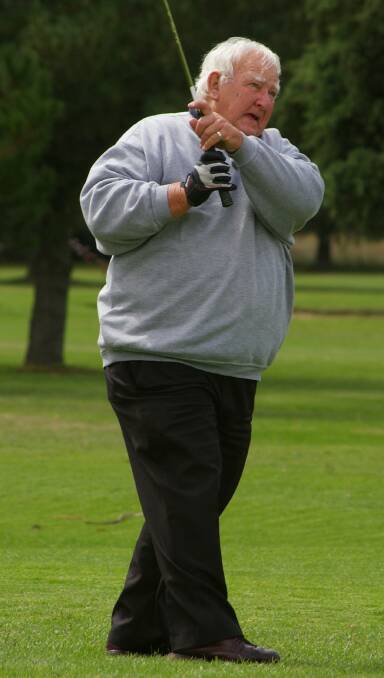 EYE ON THE BALL: When John Patrick Burns was not coaching basketball, with his family or watching the Rabbitohs, he enjoyed a round of golf. Photo: Darryl Fernance
