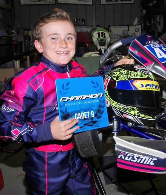 CHAMPION: Costa Toparis is the NSW Cadet-9 Champion with the blue plate and his white-on-blue champions-numbered 43 kart. Photo: Darryl Fernance