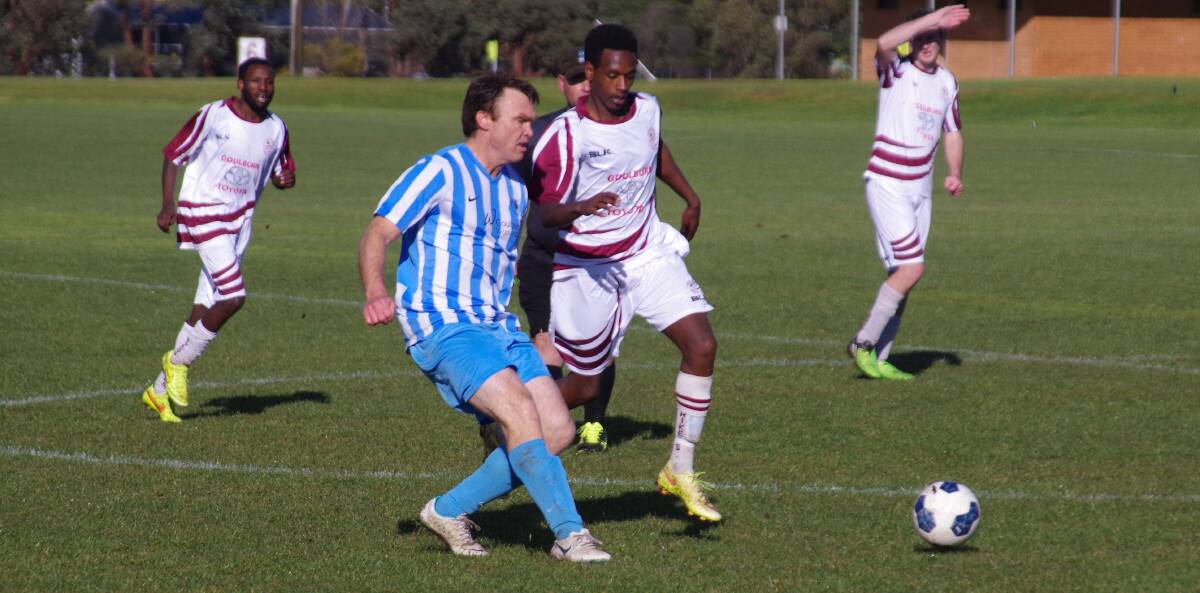 UNITED NOW: Former rivals Strikers and Stags look forward to forming formidable teams to contest the Capital Football competition in 2018. Pictured are Ben Stephenson and Eric Noheli contesting the ball during a 2016 game. Photo: Darryl Fernance