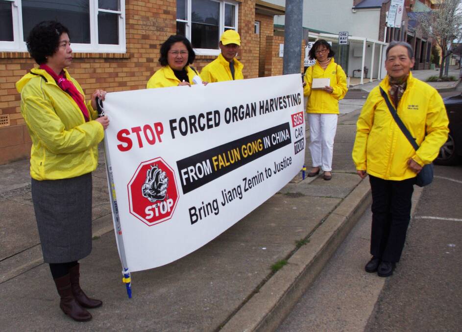 PEACEFUL PROTESTERS: Falun Gong practitioners opposite Goulburn Civic Centre l-r Xiaohong Wu a victim of the persecution, Jenny Zeng,Yichun Chen, Yuehua Cao and  Xiaofan Wang also one of the persecution victims on their first day of the 100 city tour.
