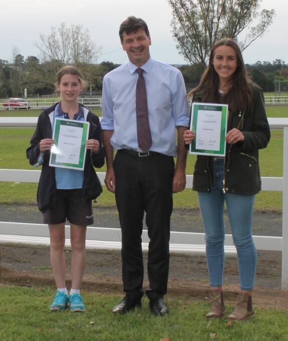 Angus Taylor with awardees Bethany Jenkins and Matilda Offord.
