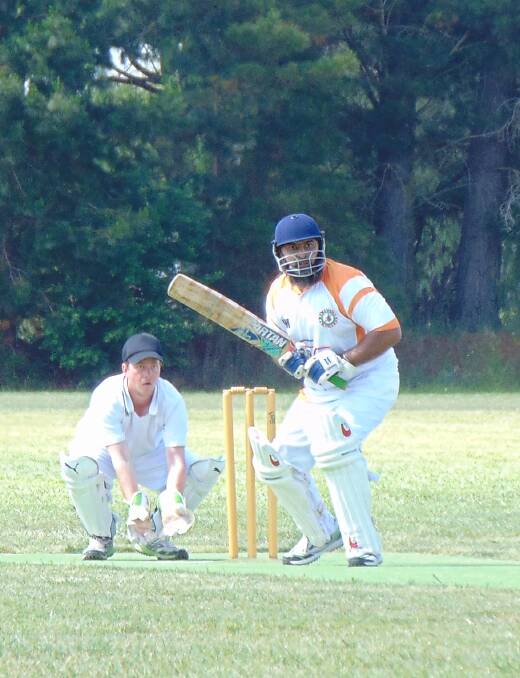 STRONG PERFORMANCE: Farooq Hammad putting on a tradesman like display of batting for Warriors, with Tom Taylor as wicket keeper for Hibo Gold. Photo: Andrew Hopkins