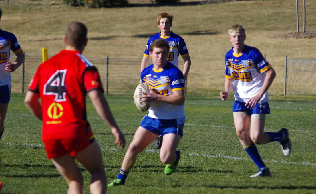 MAKING GROUND: Under 18s GWC Bulldog Joey Roberts takes the ball upfield during a recent clash with Gungahlin at the Workers Arena. Photo: Darryl Fernance
