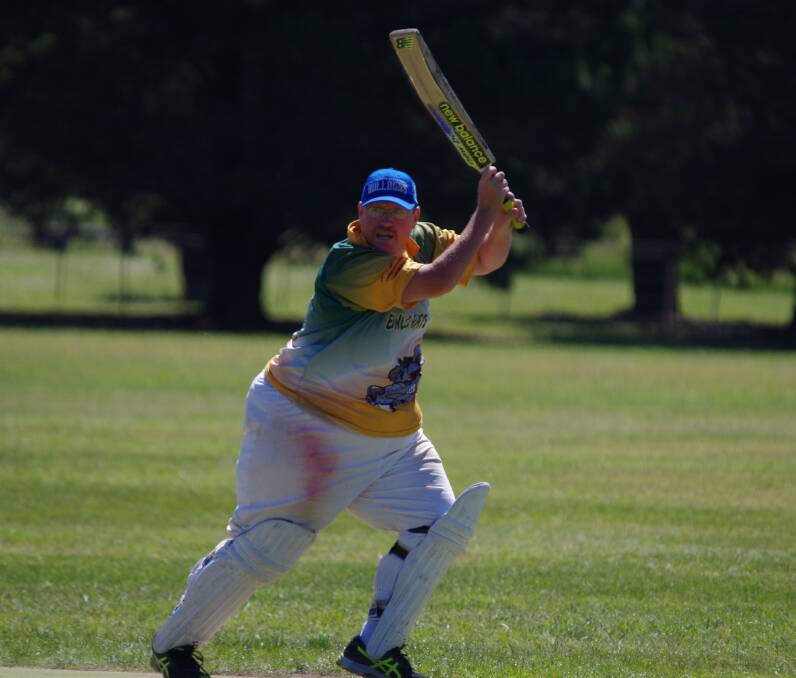 Bowlo's Shane Munro gets a shot away, out toward the boundary and a fielder.