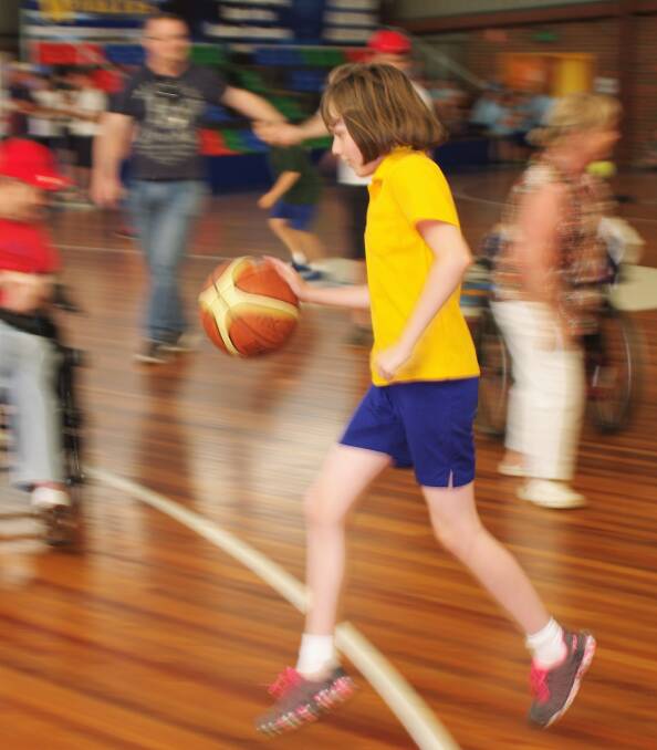 Sienna Dunn was pretty quick as she dribbled the ball down the court during International Day of People with Disabilities' fun day at the Goulburn Basketball Stadium.