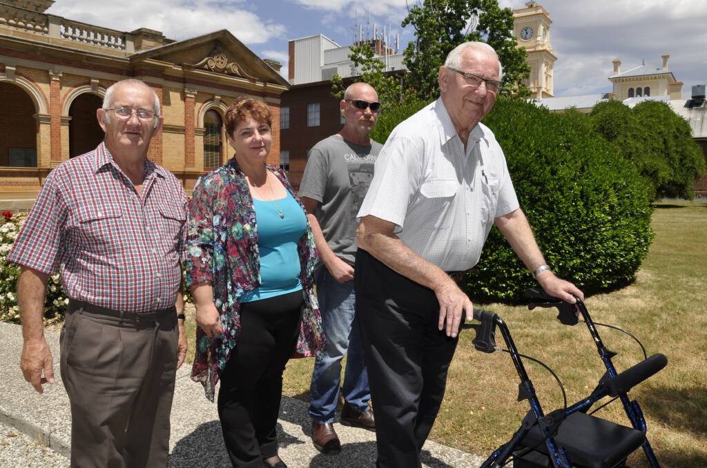 James Hughes' father Colin (right), brother Peter (second right), James's partner, Melissa Pearce and her father, Ron leave Goulburn courthouse on Wednesday, following the inquest's first session.  