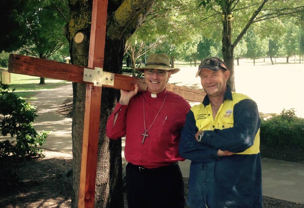 NEW CHAPTER: The outgoing Bishop of Canberra/Goulburn, Stuart Robinson chats to a parishioner during his 2015 Walk with the Cross through southwestern NSW.