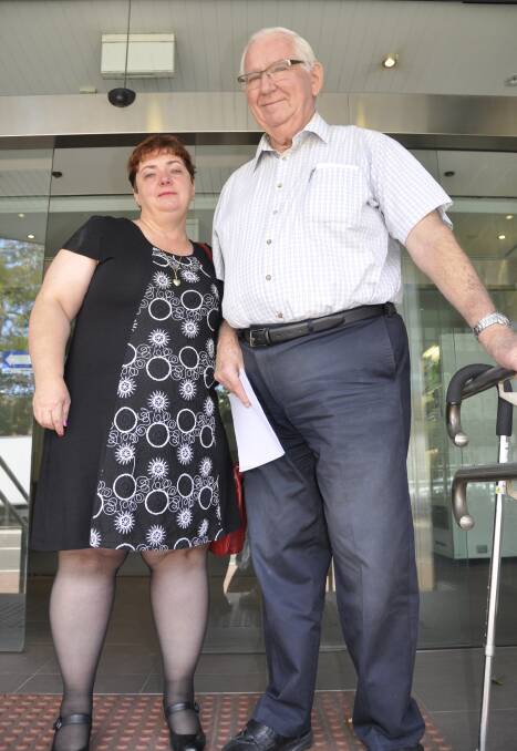 GRIEVING: James Hughes' partner, Melissa Pearce, with his father Colin outside Glebe Coroners Court on Tuesday. Ms Pearce said all councils must learn from the fatality.