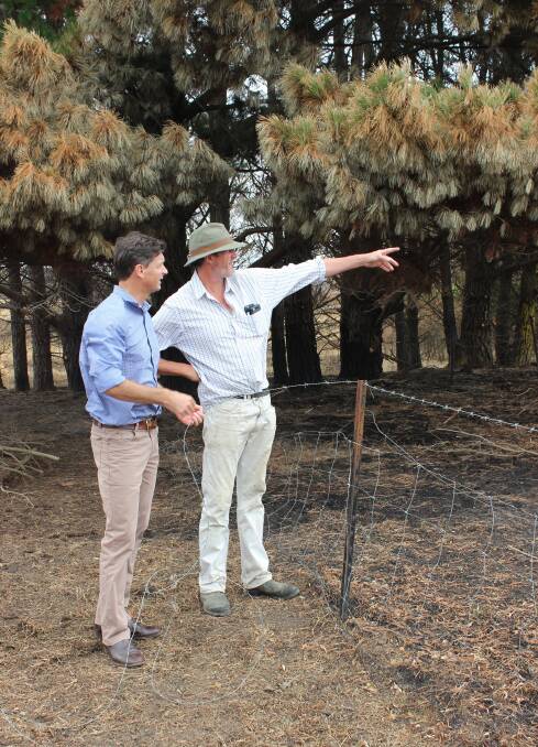 DEVASTATED: Tarago district grazier Tim de Mestre (right) shows Hume MP Angus Taylor the extent of damage to his property, 'Merigan.' Photo supplied.