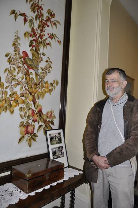 Stephen Horn, the great nephew of former Riversdale owner, Alice Joan Twynam, donated surveying equipment to the exhibition. He took the opportunity to look at the tapestry his great aunt designed. Photo: Louise Thrower. 