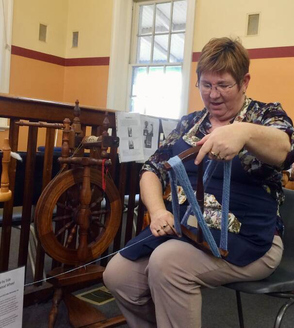 Creative Gunning President Helen Vooren demonstrating how to wind yarn onto a niddy noddy. Picture by Creative Gunning Inc.

