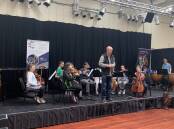 Young people tried out orchestral instruments at the Hume Conservatoroum's recent holiday workshop, Squawkestra. Picture supplied.
