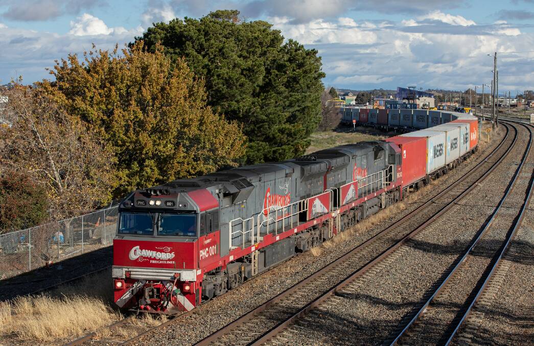 LONG HAUL: One of the Crawford trains snaking its way from the rail hub to port. Photo supplied.