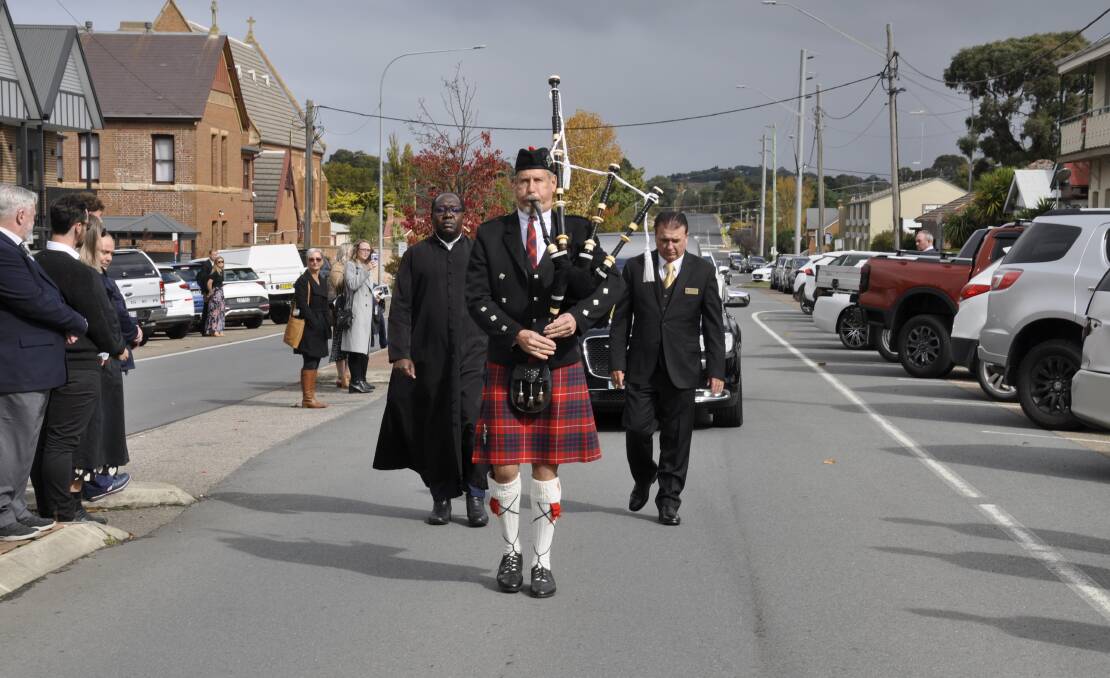 Piper Andrew Fraser led Steve Armstrong's funeral procession along Bourke Street. Picture by Louise Thrower.