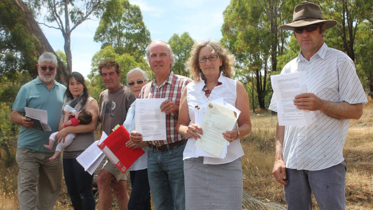 LOVED: Annie and Andrew Basnett (fourth and fifth left) cared deeply for their community. They were pictured here in 2014 protesting a mototrack facility at nearby Ladevale Road. Former Upper Lachlan Mayor John Shaw said despite the facility's eventual approval, Mr Basnett rang and thanked him for his efforts and "accepted the umpire's decision." 