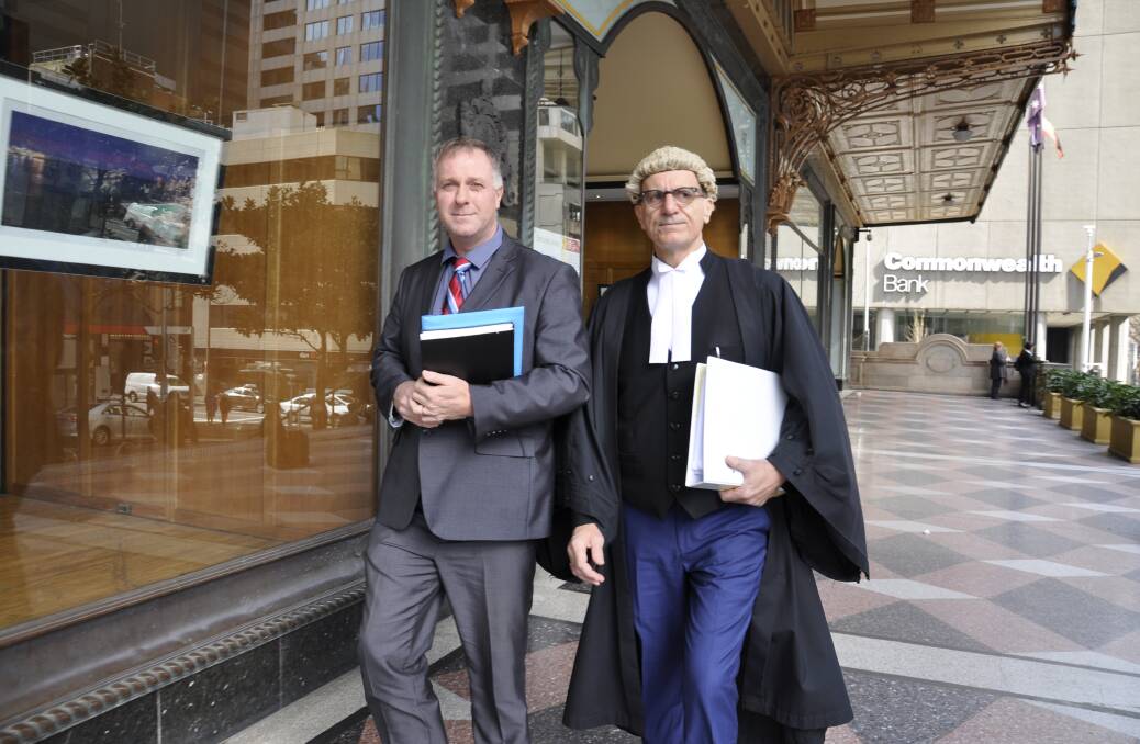 ARGUING THE CASE: Goulburn Detective Senior Constable David Turner leaves the Downing Centre with Crown prosecutor Lou Lungo. Photo: Louise Thrower.