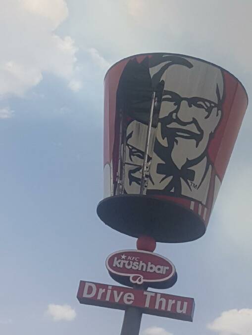 Strong winds damaged the bucket on the KFC advertising sign at Marulan. Photo courtesy SES.