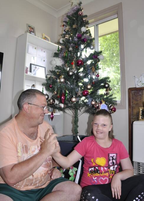 HIGH FIVE: Dean Reed reckons daughter Bethany is his best gift yet. The 10-year-old, who has cerebral palsy, acted quickly after her dad collapsed last week.