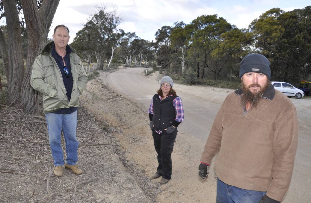NOT HERE: Bernie Dryden, Jeanelle and Jason Slater argue that Bullamalita Road is not equipped to handle quarry trucks from a nearby planned operation.
