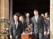 Steve Armstrong's sons, James and Brad, front and daughter, Carlie (right rear) were pallbearers at their father's funeral service at Sts Peter and Paul's Cathedral on Tuesday. Picture by Louise Thrower.
